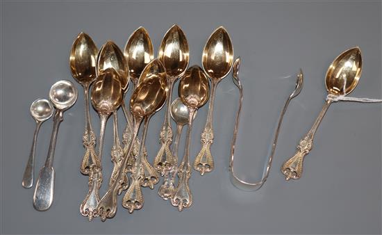 A set of twelve sterling coffee spoons, two silver condiment spoons and a pair of silver sugar tongs.